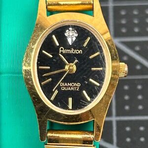 Armitron Diamond Quartz Womens Watch Gold Tone‎ Black Dial Oval 25/5116 400/101